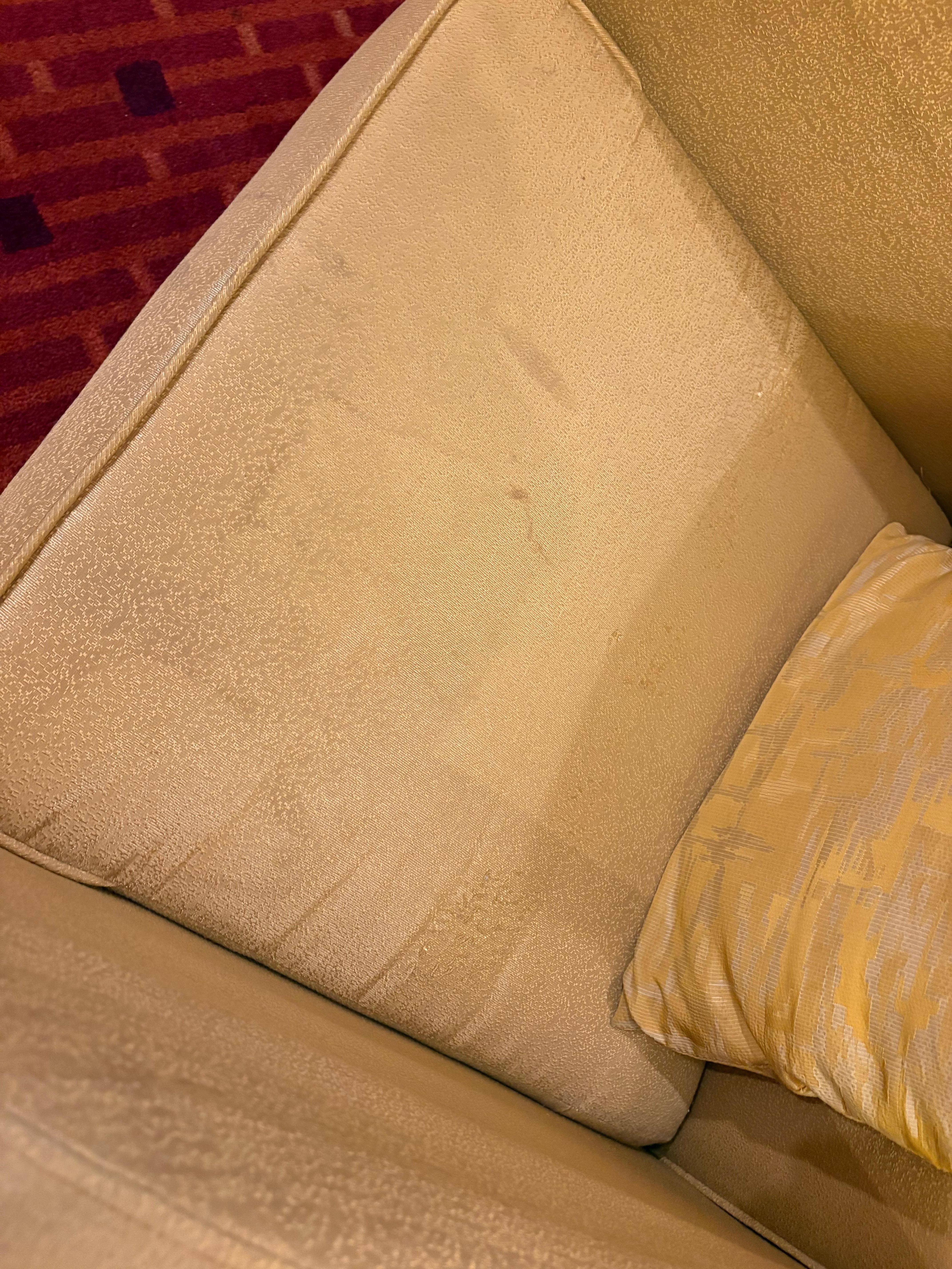 Chair in the room covered in stains and absolutely filthy. 