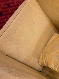 Chair in the room covered in stains and absolutely filthy.