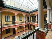 An internal atrium with doors to guest rooms