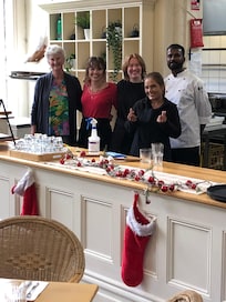 Lovely Café staff with guest on the left