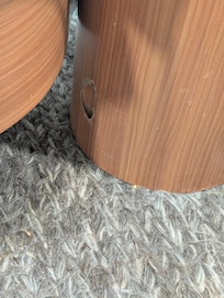 Dirty rug. Looks like crumbs on the floor.