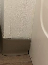 Peeling paint on wall.