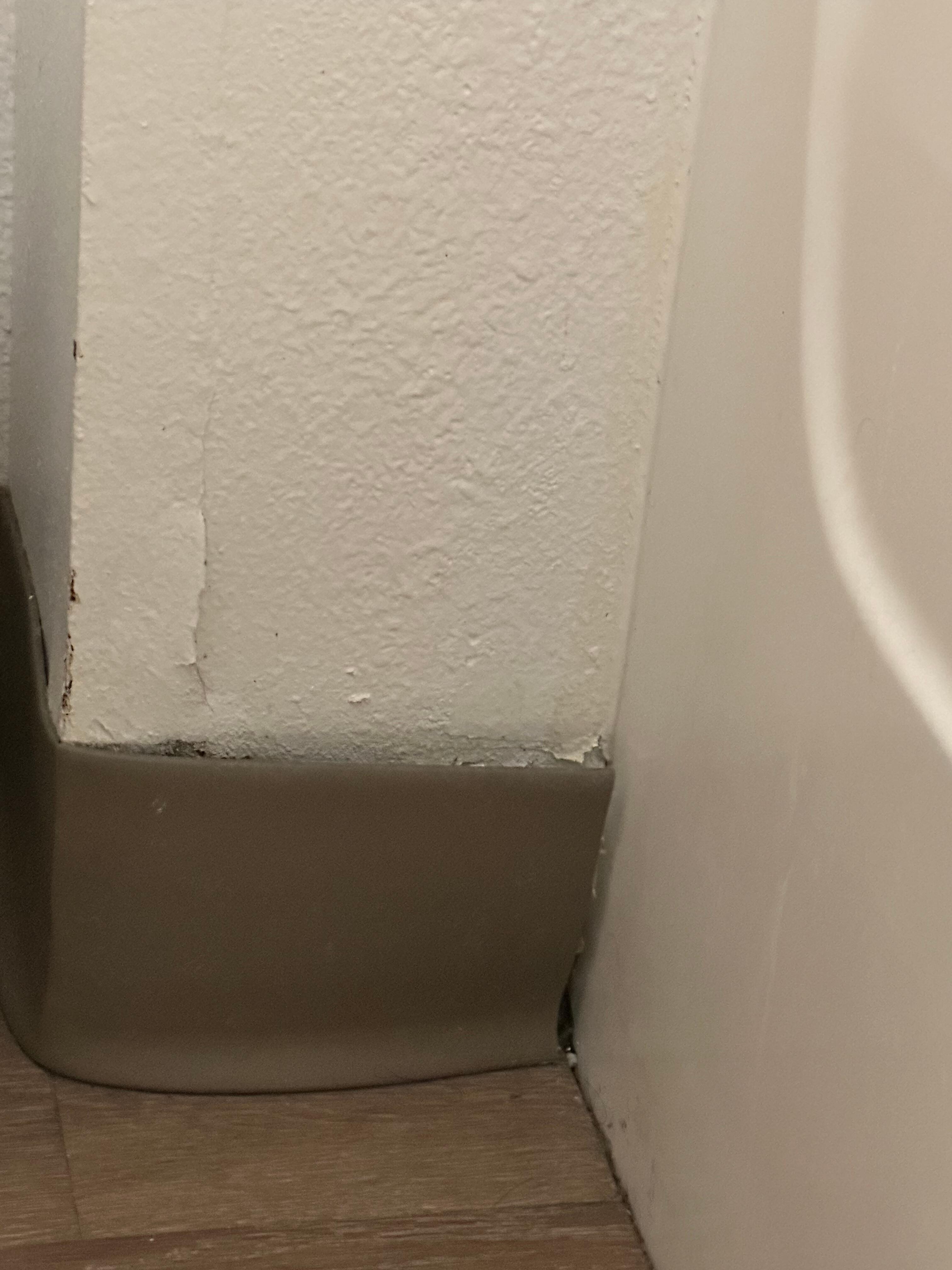 Peeling paint on wall. 