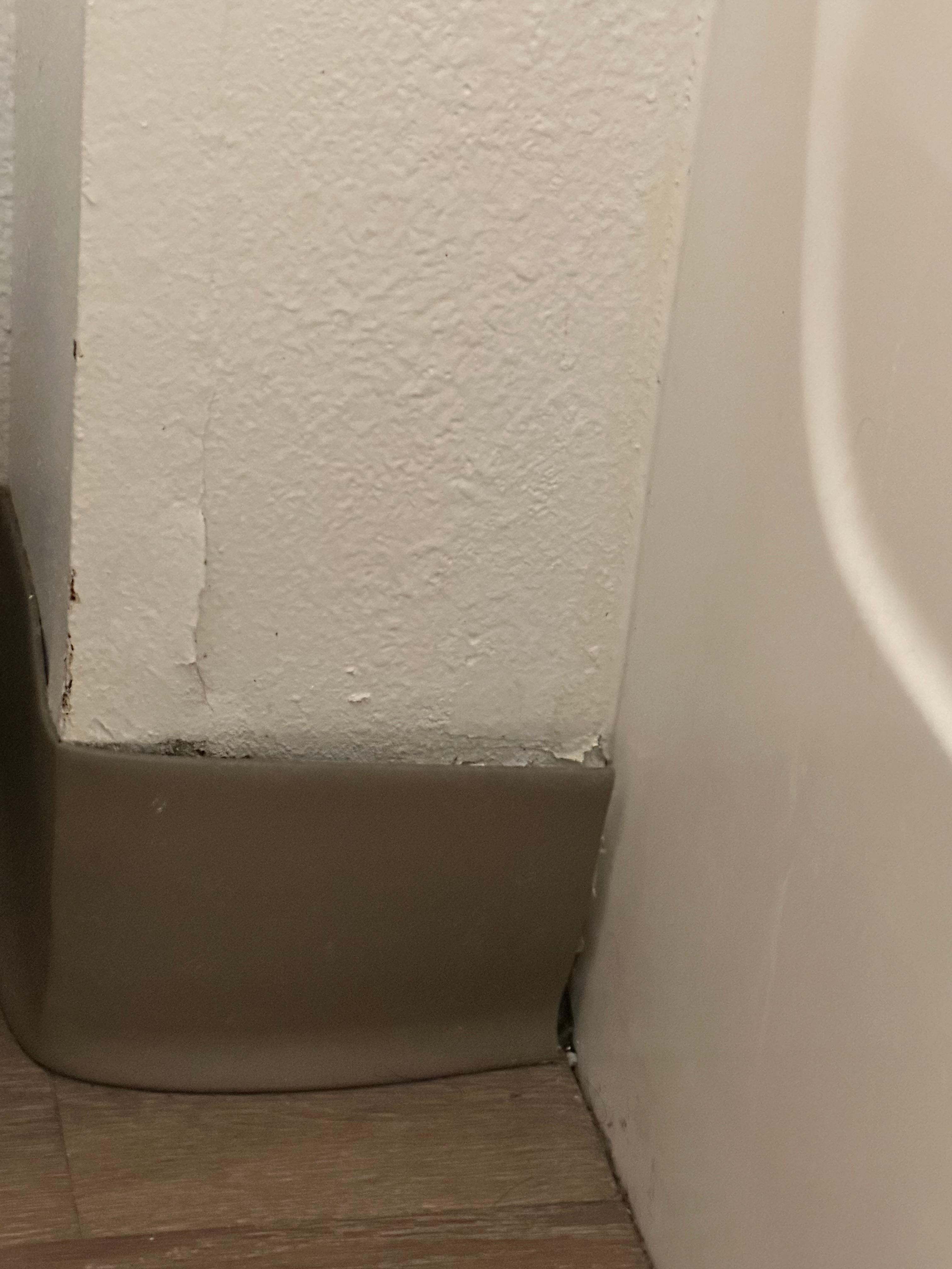 Peeling paint on wall.
