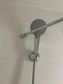 Top shower holder was not accessible as there was a pole in the way