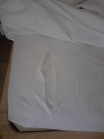 Ripped bed sheet