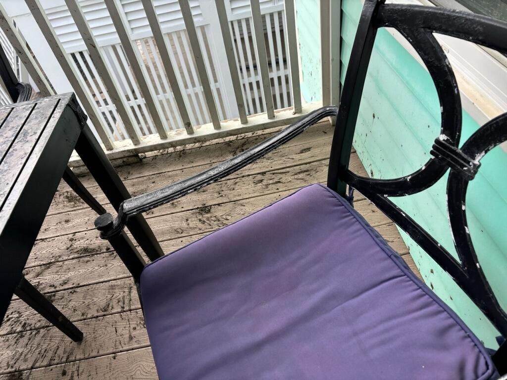 Dirty porch to greet us at checkin with dingy patio furniture 