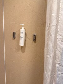 This bathroom is missing amenities that were supposed to be provided. This is a picture of some conditioner that was left behind.