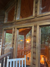 A photo of cob webs in the edges of windows