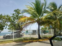 Beautiful beach across the street calm and clear waters.