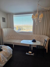 A 10 foot chaise capped of the royalty themed room