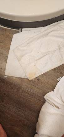 The floor towel after getting wet just turned yellow and there's a bunch of debris from the floor stuck to it after wiping water from all around.