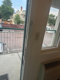 Door to room that has clearly been kicked in a few times