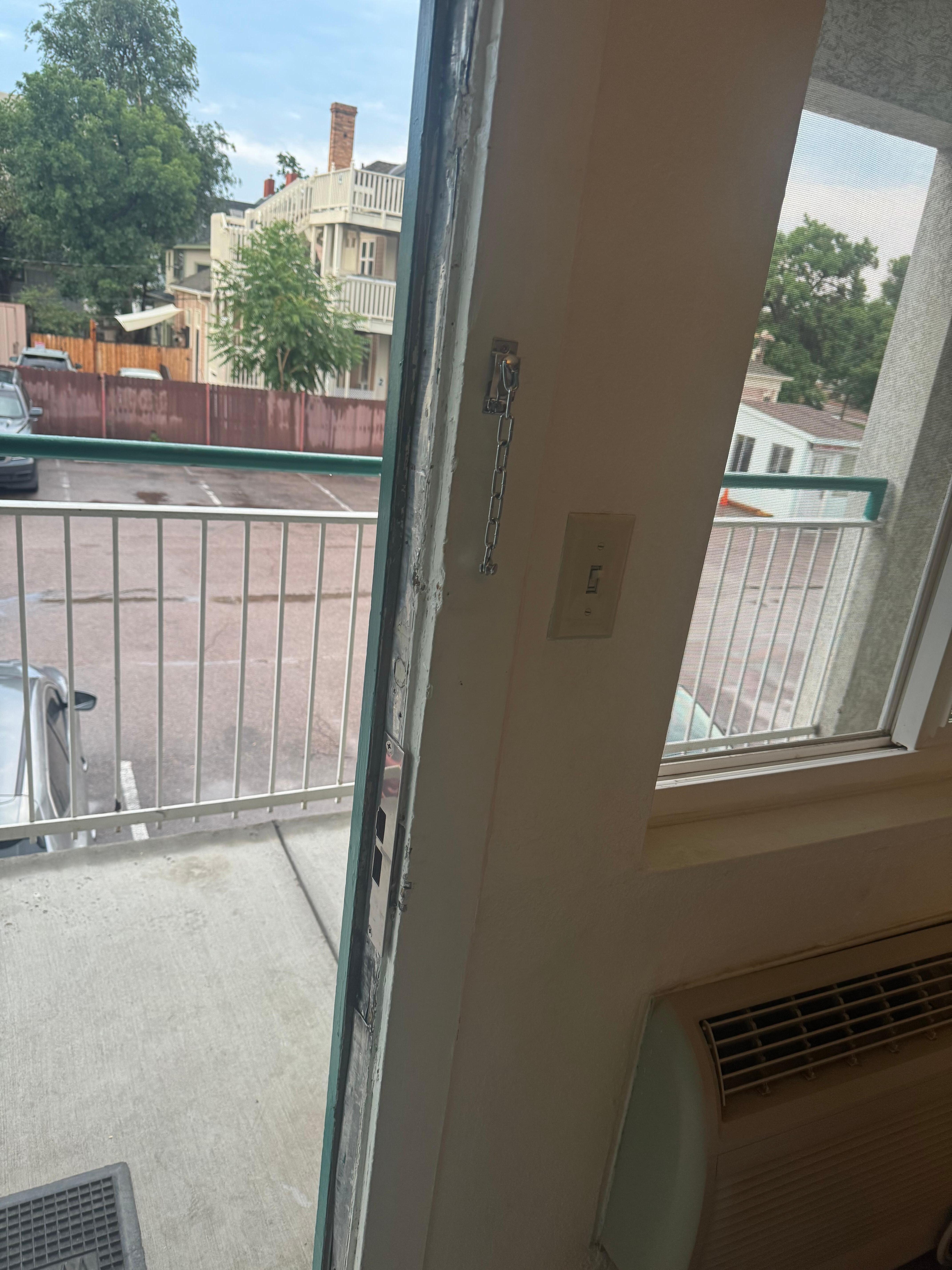Door to room that has clearly been kicked in a few times