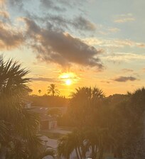 View of sunset from the third floor balcony.