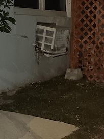 Outside of the property AC unit is falling no caulk around the foundation