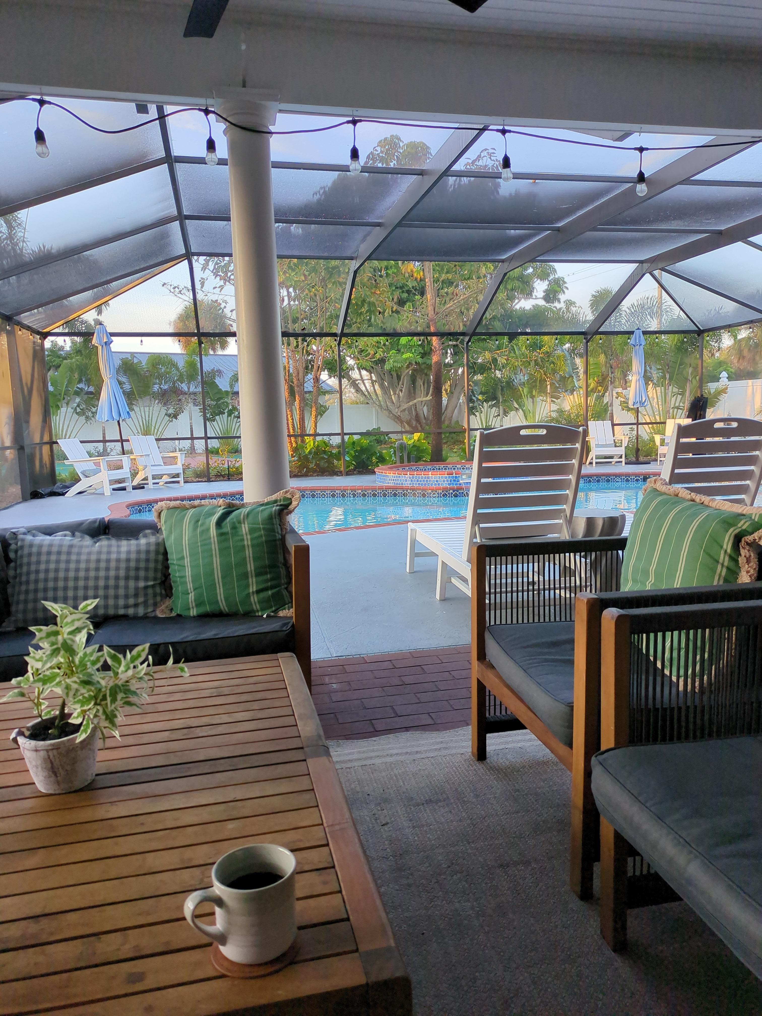 Enjoying morning coffee in a beautiful backyard space