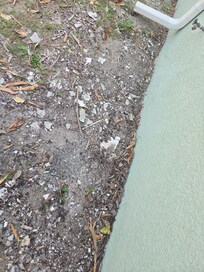 exterior plaster debris all around house