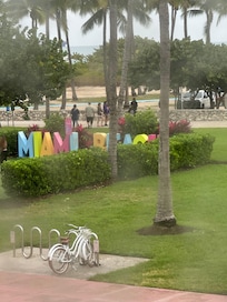 Directly across the street from beach and the Miami Beach sign which is a huge hit for tourists lining up for pics .
