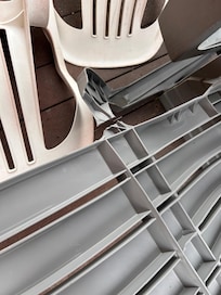 Broken plastic chair on deck