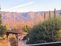 Sunset reflecting off mountains. View from porch.