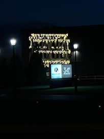 Night view with the lights & the historical fisherman’s wheel.