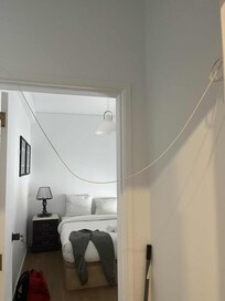 Wire hanging loose between bedroom and washroom