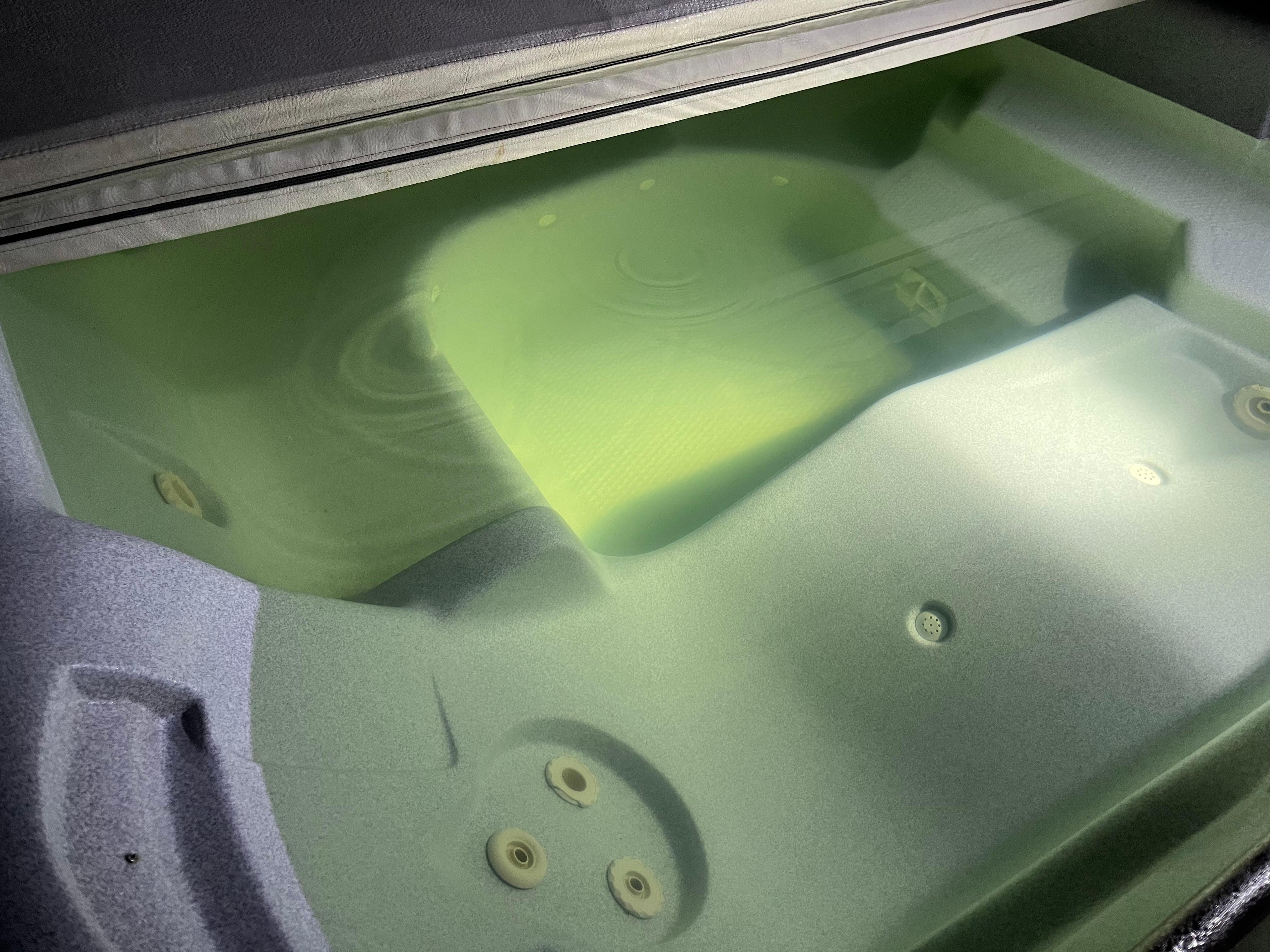 Hot tub should be clear. This looks like algae! We chose this place for the hot tub and BBQ but couldn’t use either. 