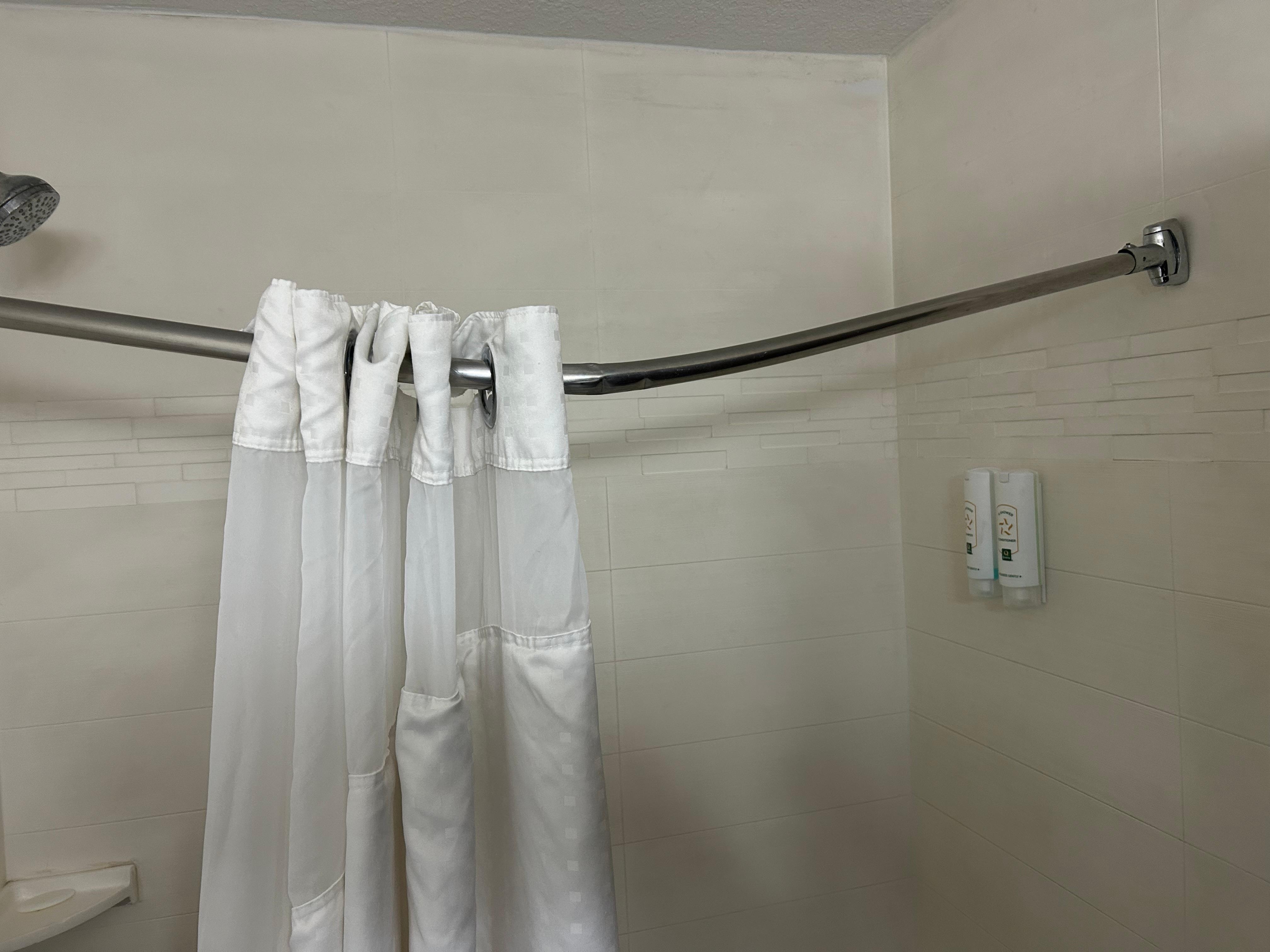 Shower curtain was broken. It stay up and just hung in the dirty water 