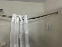 Shower curtain was broken. It stay up and just hung in the dirty water