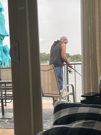 Hubby fishing off the balcony