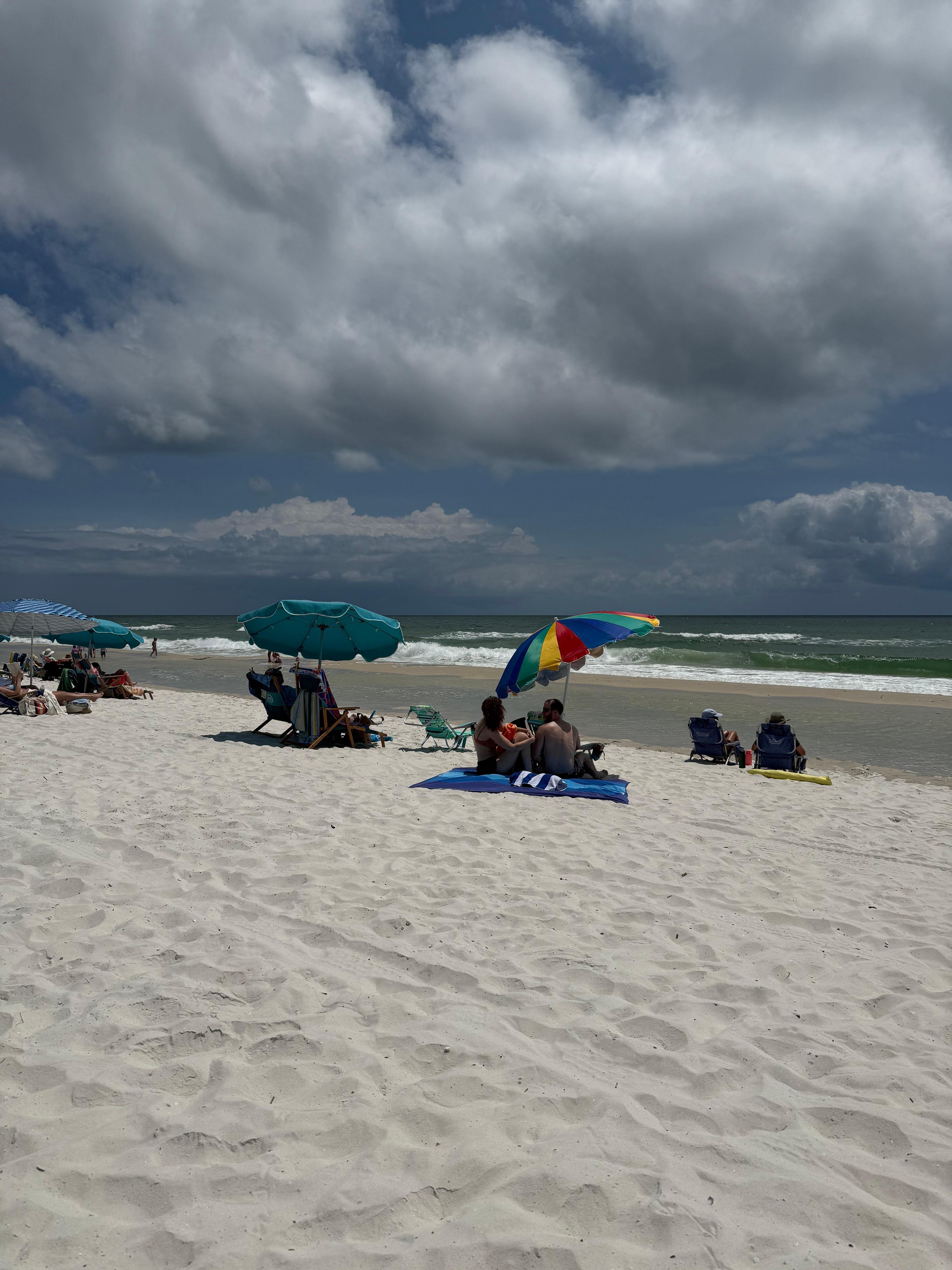 On the beach in front of condo with my family. 