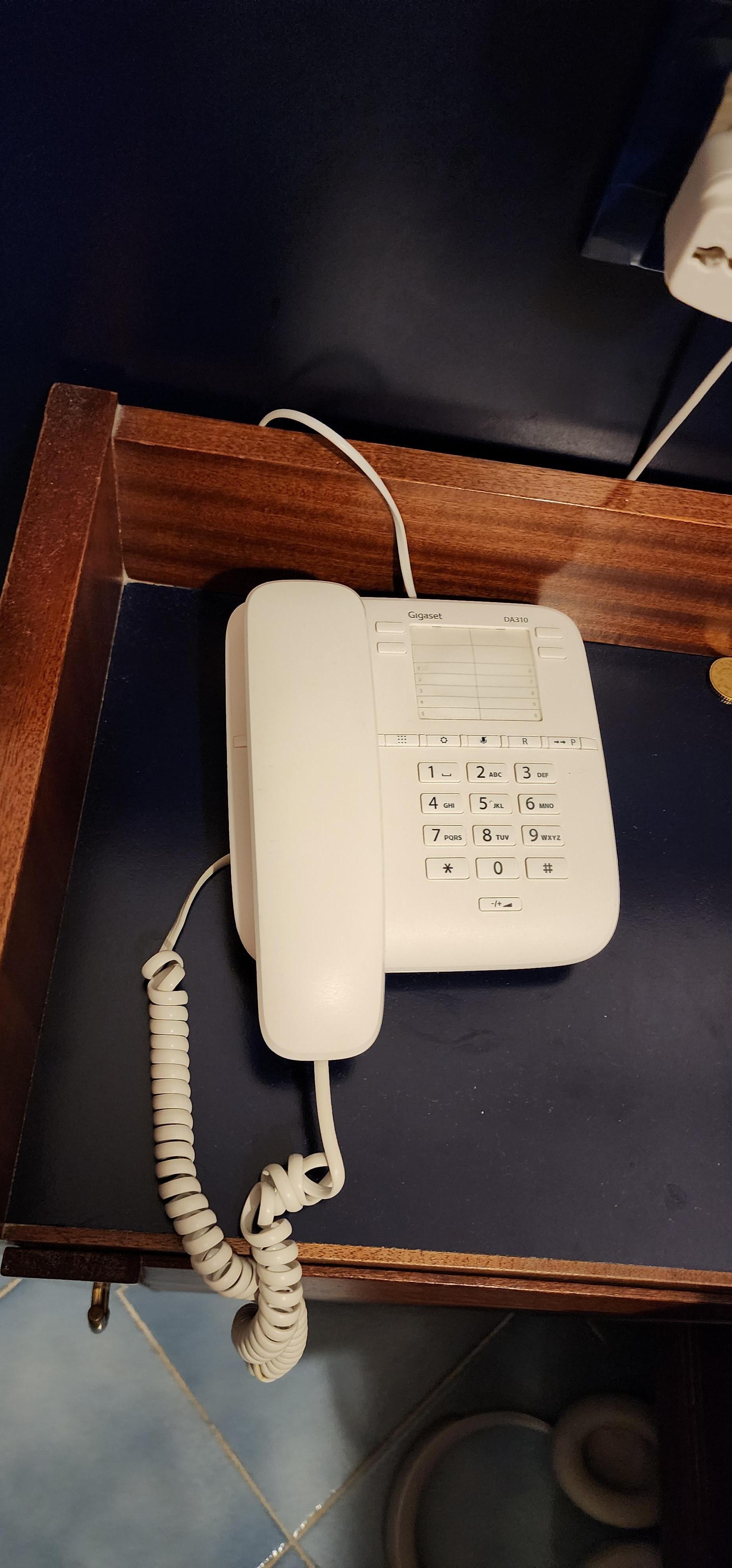 No dialing instructions on how to call reception or another room or how to make local calls.