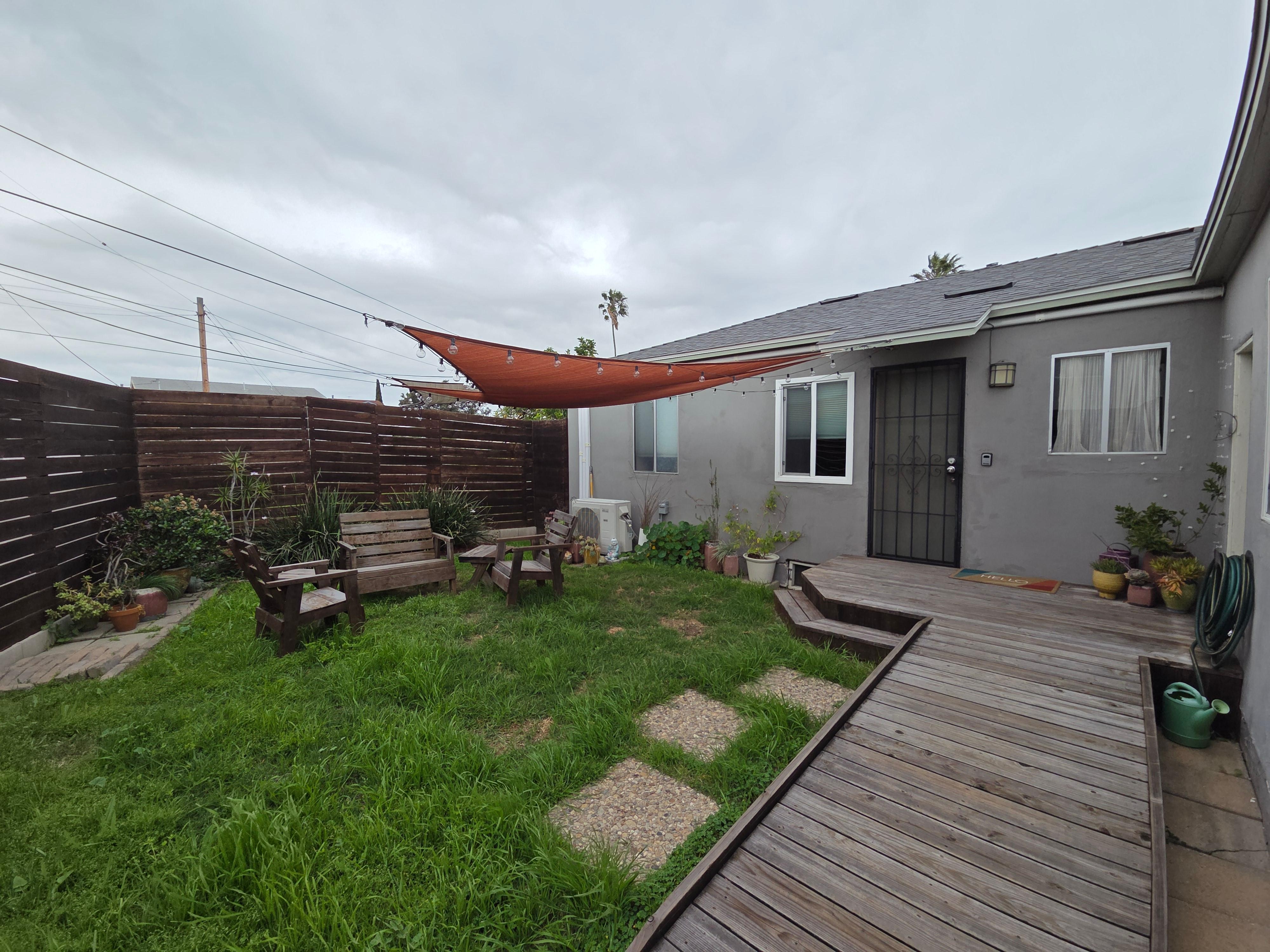 The little fenced in yard at the front of the house