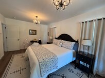 Spacious main bedroom with super comfy bed (about medium-firm)