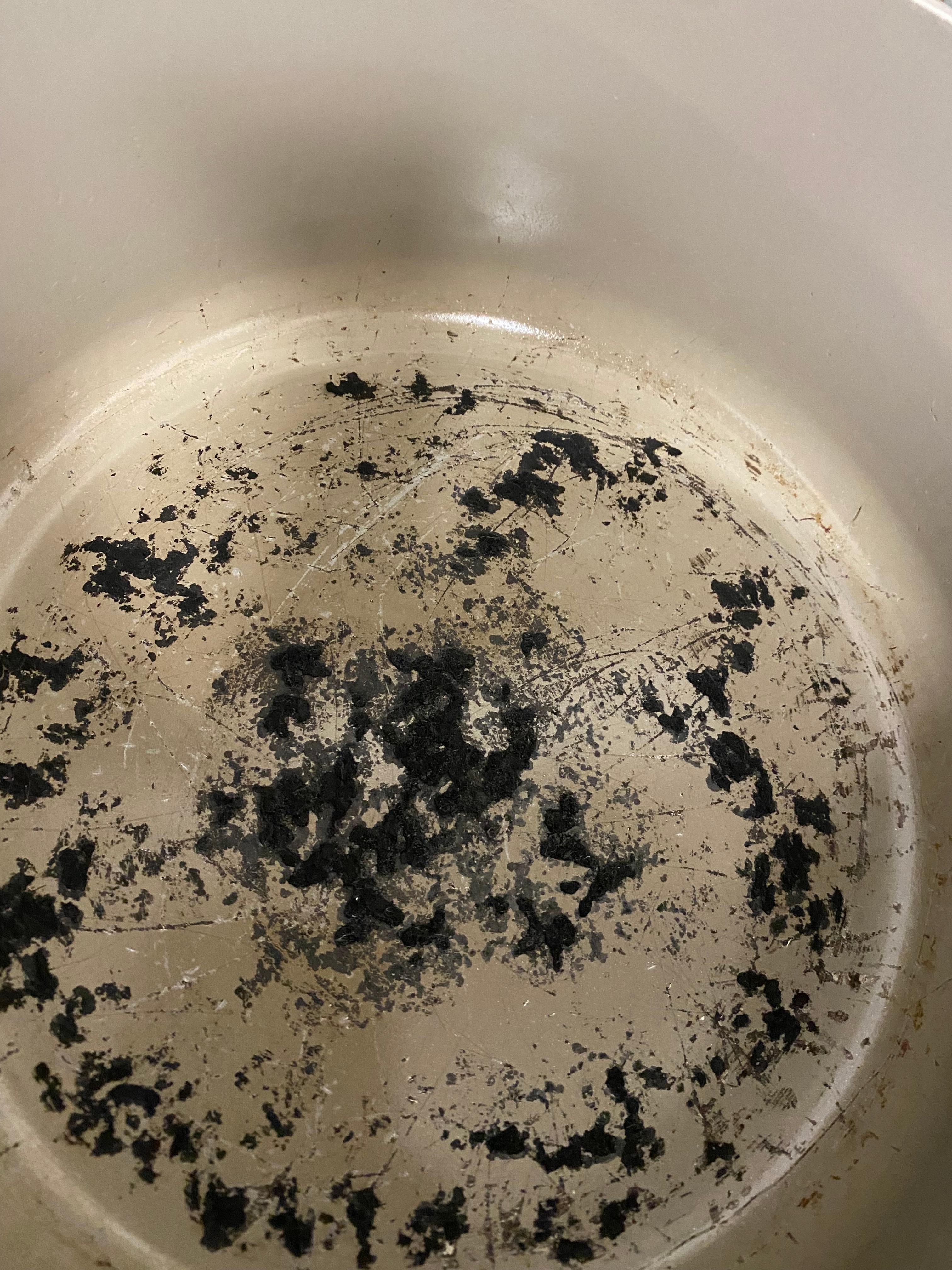 Many dirty, moldy, rusted pots, pans, utensils and glasses