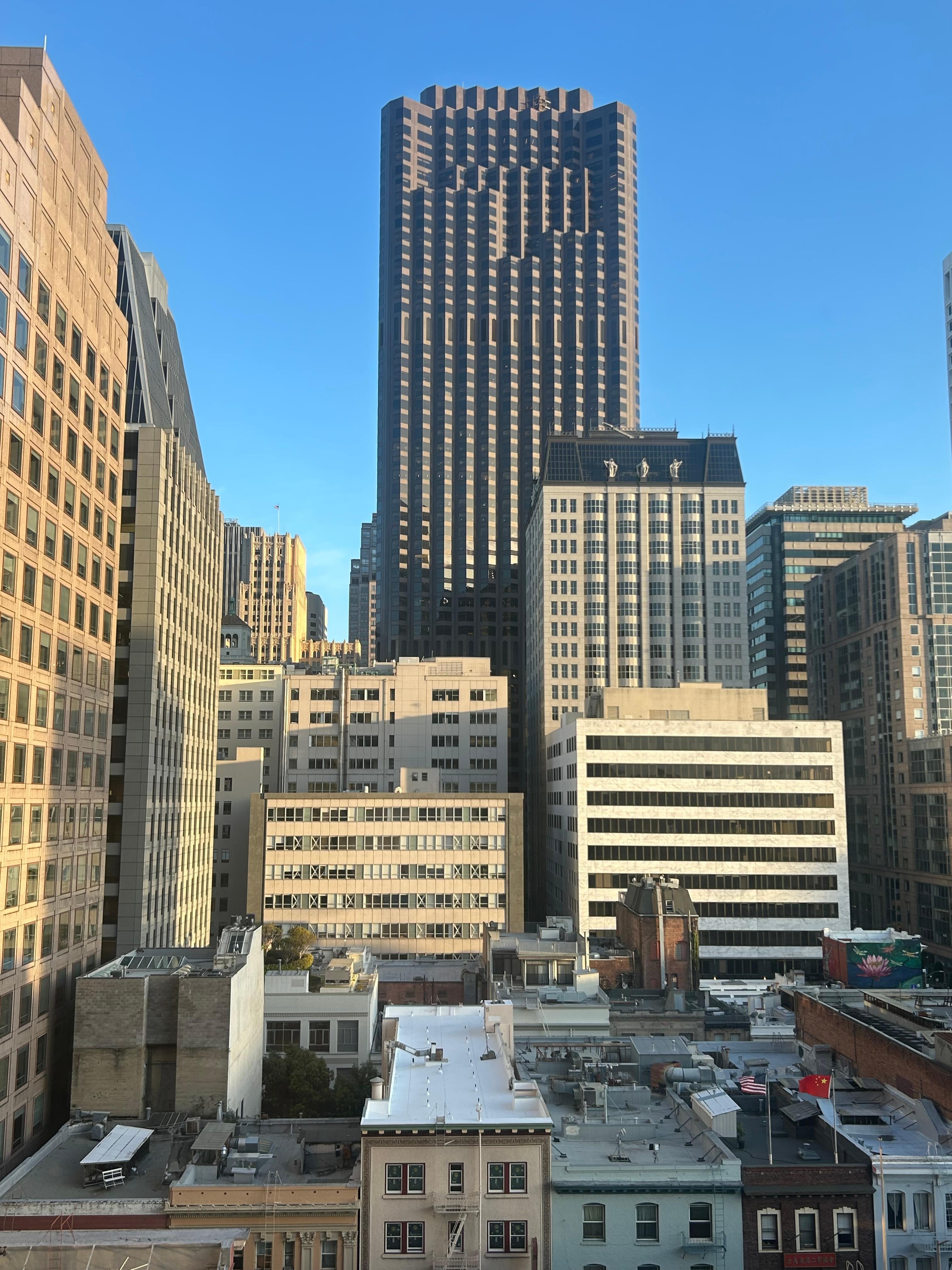 Worth leaving drapes open to look out the window seeing variety of buildings.