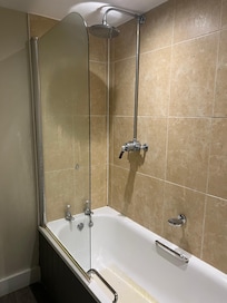 Bath with shower over