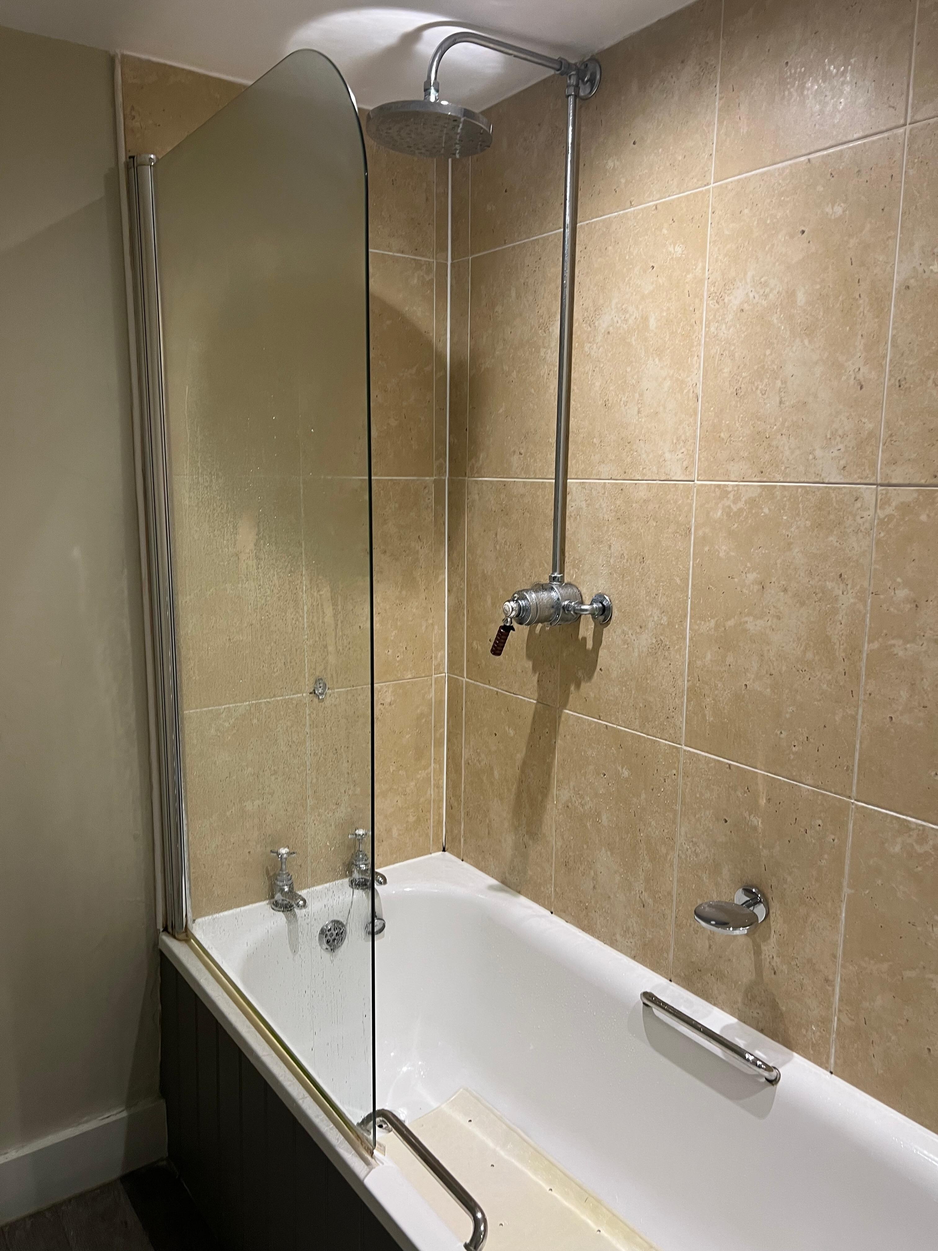 Bath with shower over