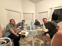 Card games around the spacious table.