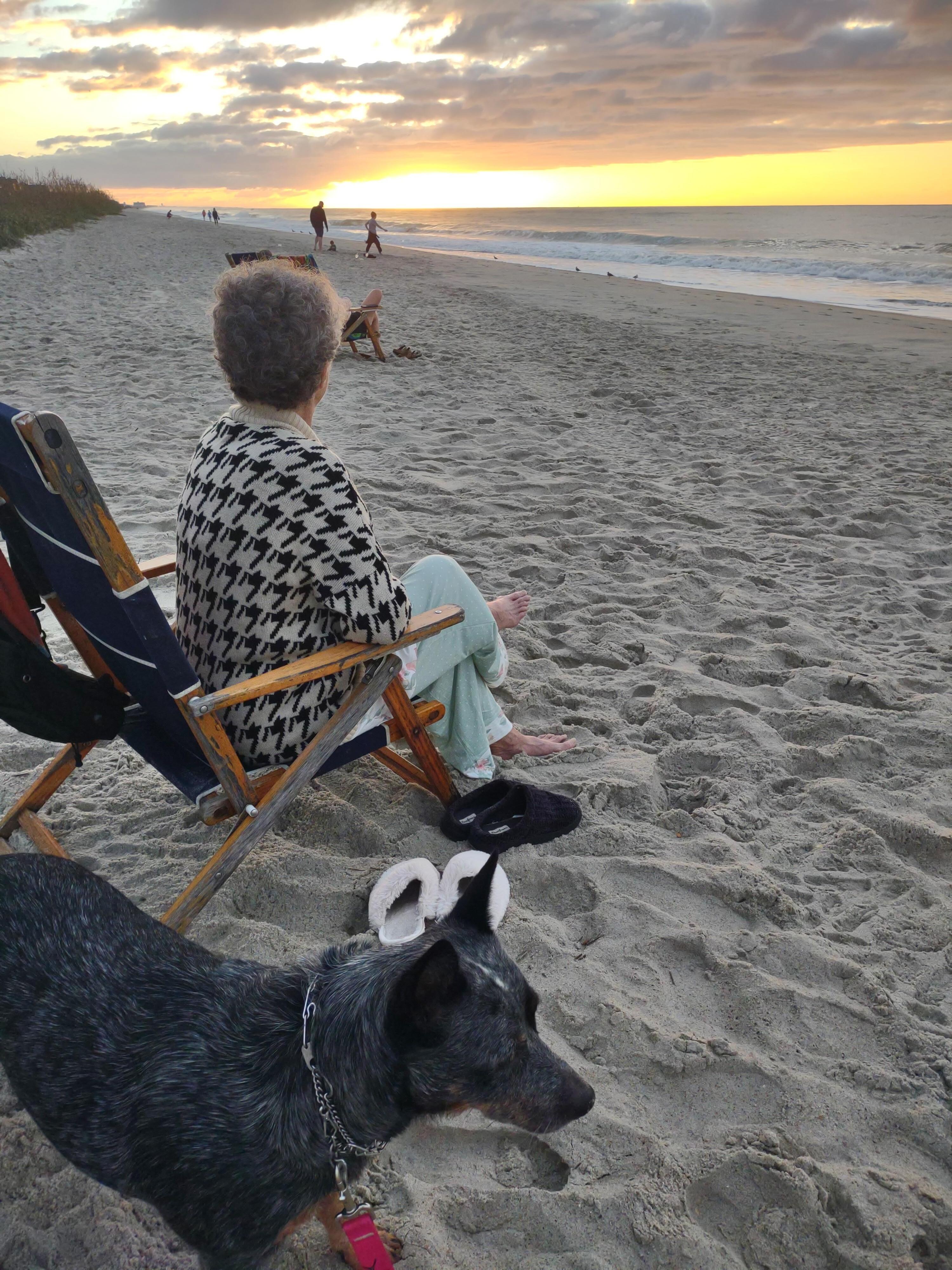 Mom feeling the sunrise on her face. 