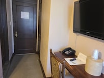 Desk in the room and door to the hallway