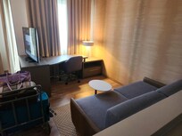 Livingroom area (couch is deep, thus uncomfortable)