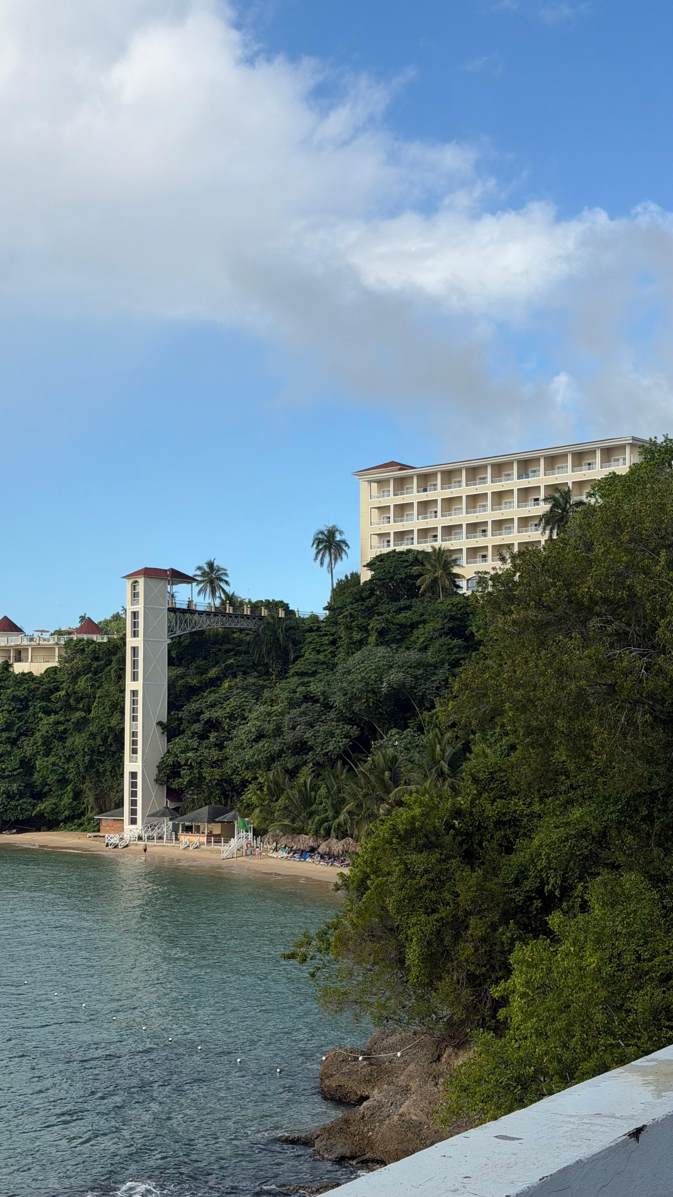 Hotel from the bridge, small strip of beach where the sun goes behind the bridge from 4 pm