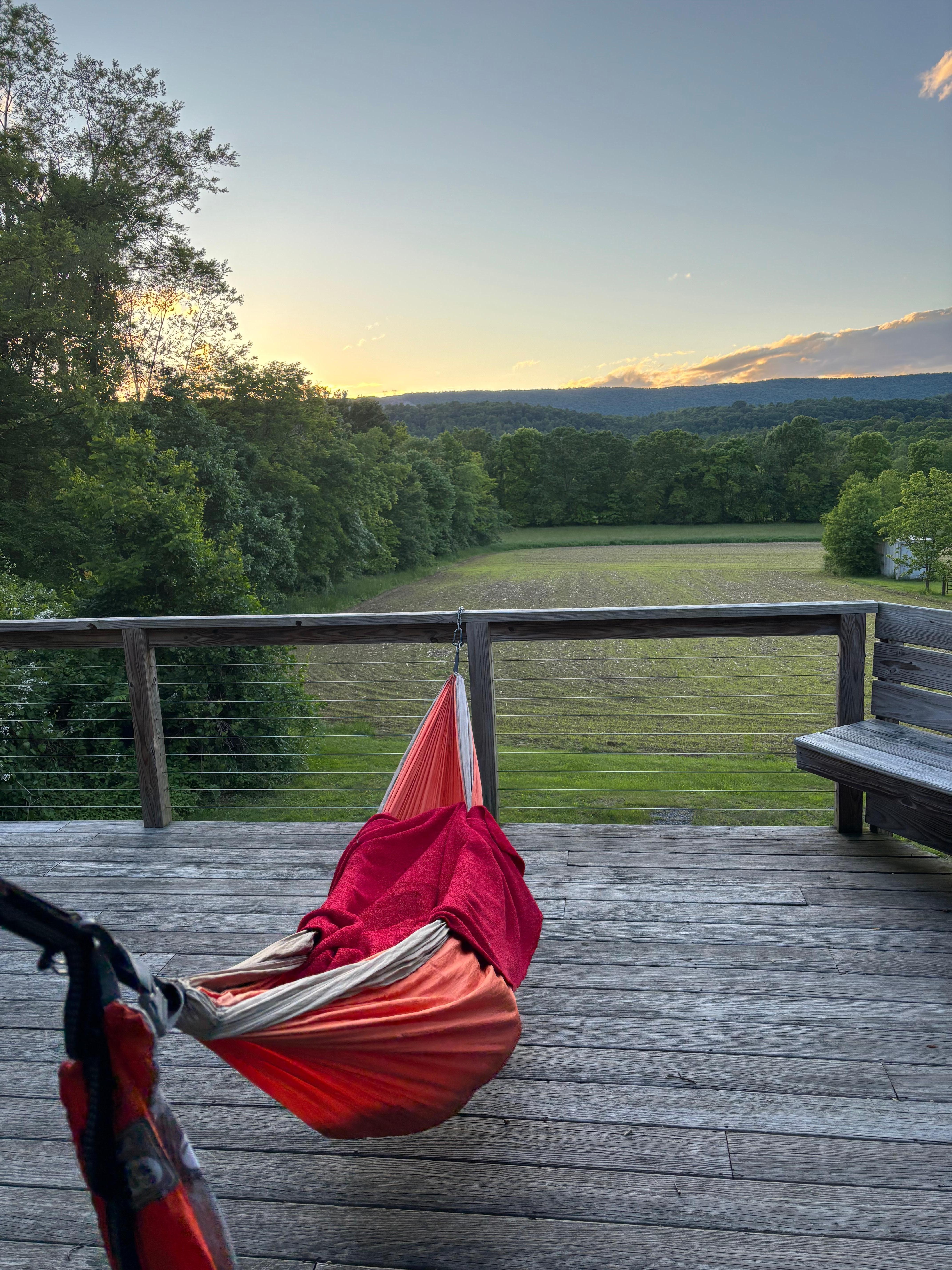 Watching the sunset over the hills from the front porch in one of the provided hammocks