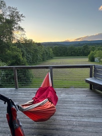 Watching the sunset over the hills from the front porch in one of the provided hammocks