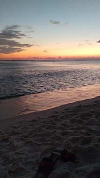The view of sunset from the beach at the Majestic Towers