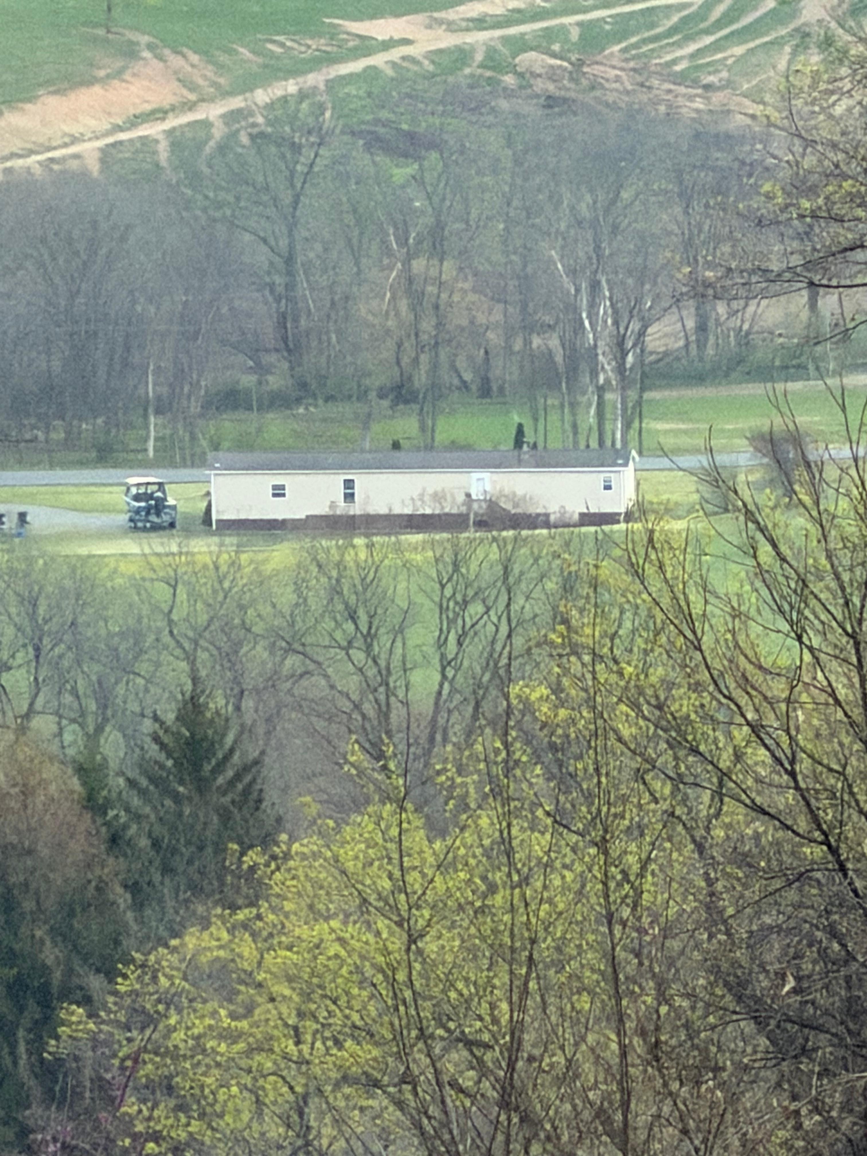 A zoomed in shot from on the mountain rd behind the house with my boat next to the house and you can see, plenty of parking.