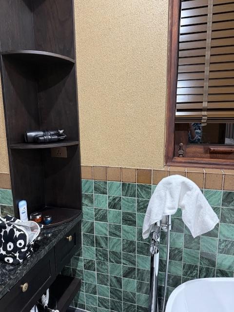 Would love a mirror on this wall since outlet is here - there is a window above the sink so no mirror above sink  and maybe a hook for the towel?