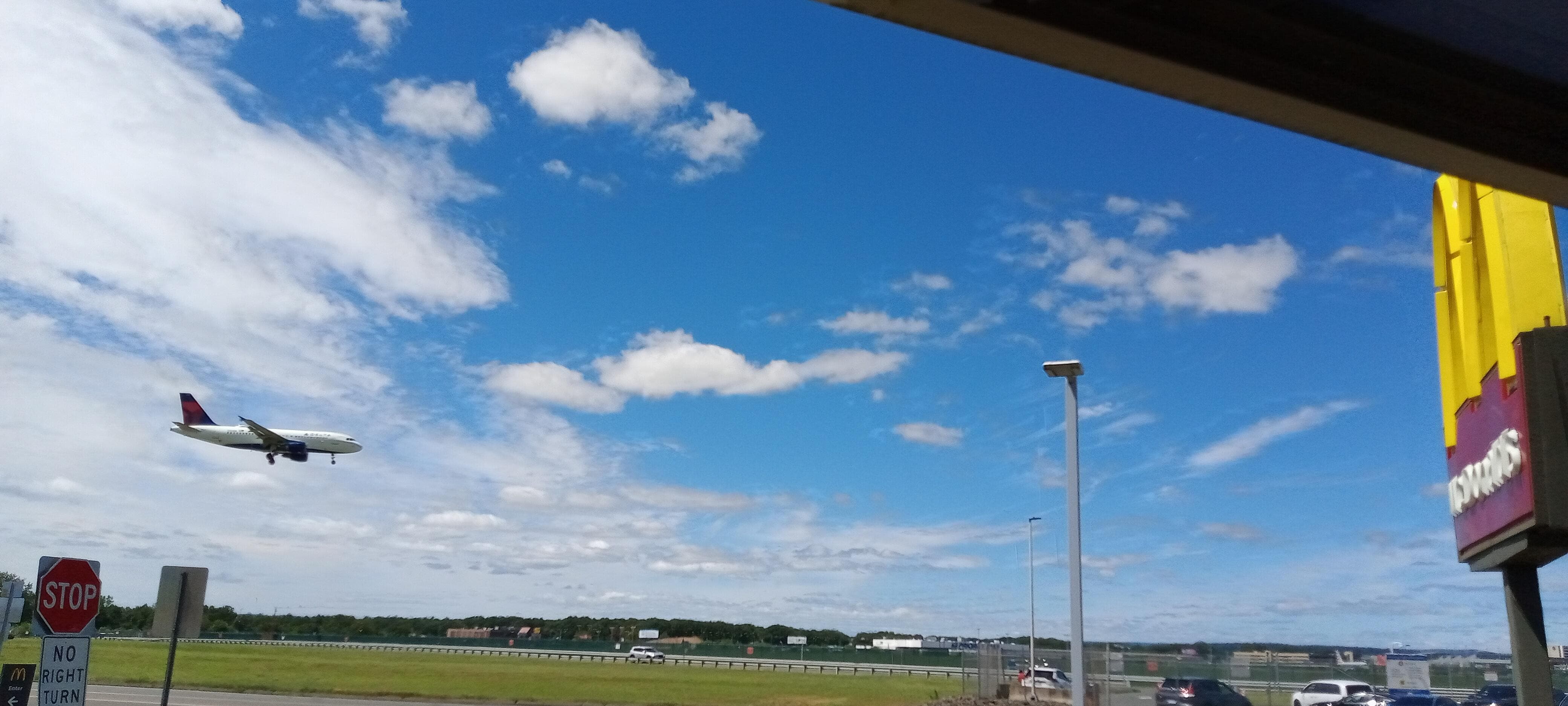 Watch planes take off and land from the hotel or next door at McDonald's